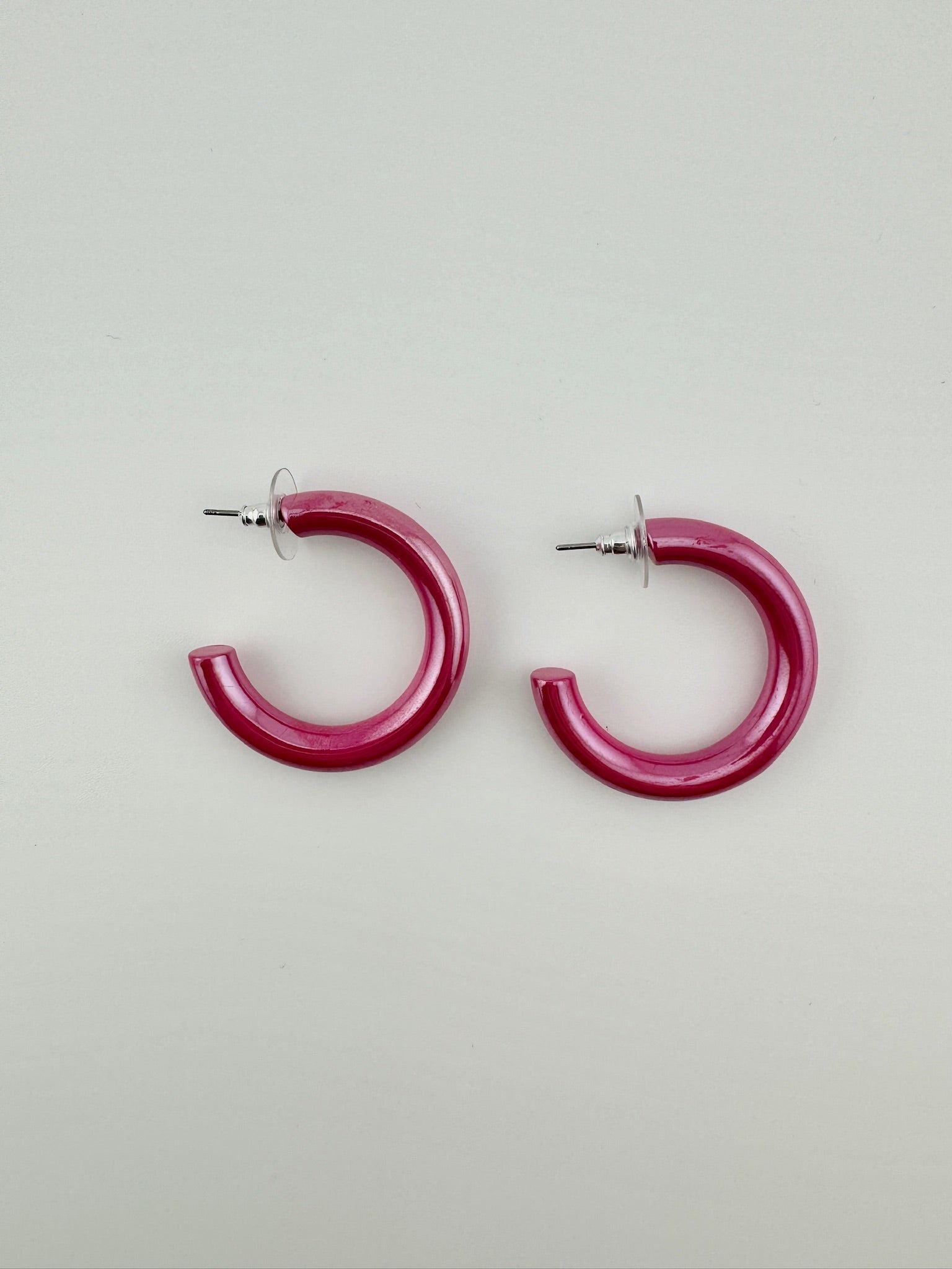 Shiny pink hoop earrings