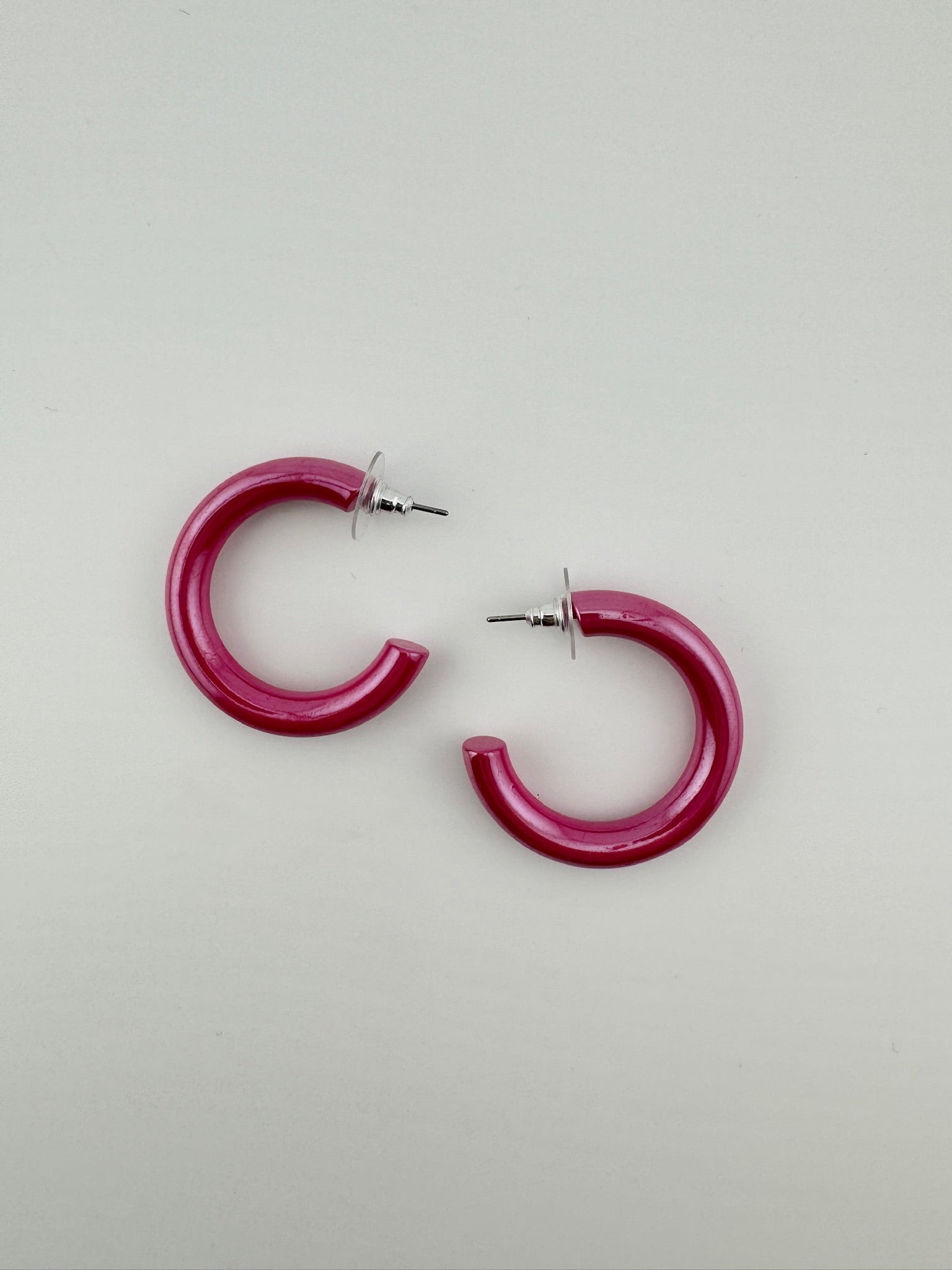 Shiny pink hoop earrings